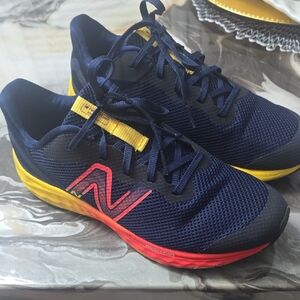 New Balance Dark Blue Sneakers with Vibrant Yellow and Red